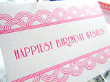 Letterpress art deco birthday cards that read "Happiest Birthday Wishes" in neon pink ink with shimmer aqua envelopes, by inviting in Austin, Texas.