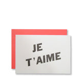 Letterpress Je T'aime valentine card, printed in black ink on white cards with flamingo pink envelopes, by inviting.