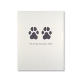 Letterpress pet sympathy card of dog paw prints and "I'm sorry for your loss" printed in black ink.