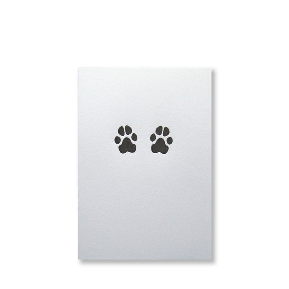 Letterpress dog paws folded note cards in black ink by inviting letterpress in austin texas.