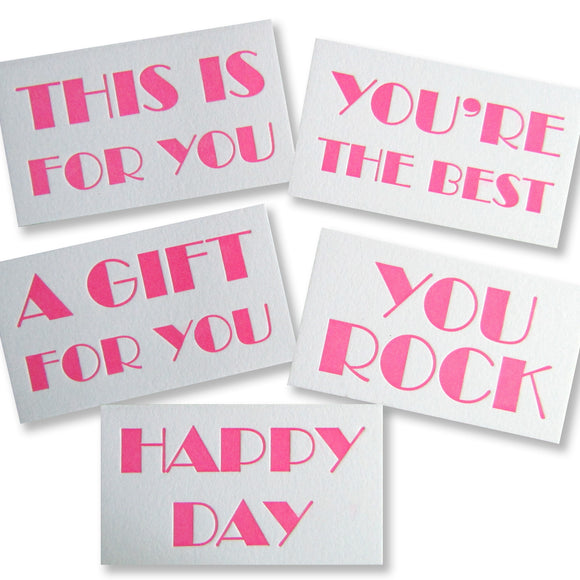 Letterpress gift tag enclosure cards in neon pink, This is for you, A gift for you, Happy Day, You're the Best, and You Rock, assorted packs, by inviting in Austin, Texas.