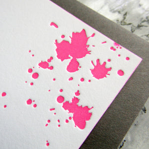 Letterpress blood splatters stationery, shown in neon ink on white cards, by inviting letterpress in Austin, Texas