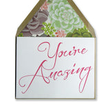 Letterpress card for your amazing friend, you're amazing is printed in fuchsia ink, with brown envelopes lined with succulents, by inviting in austin texas